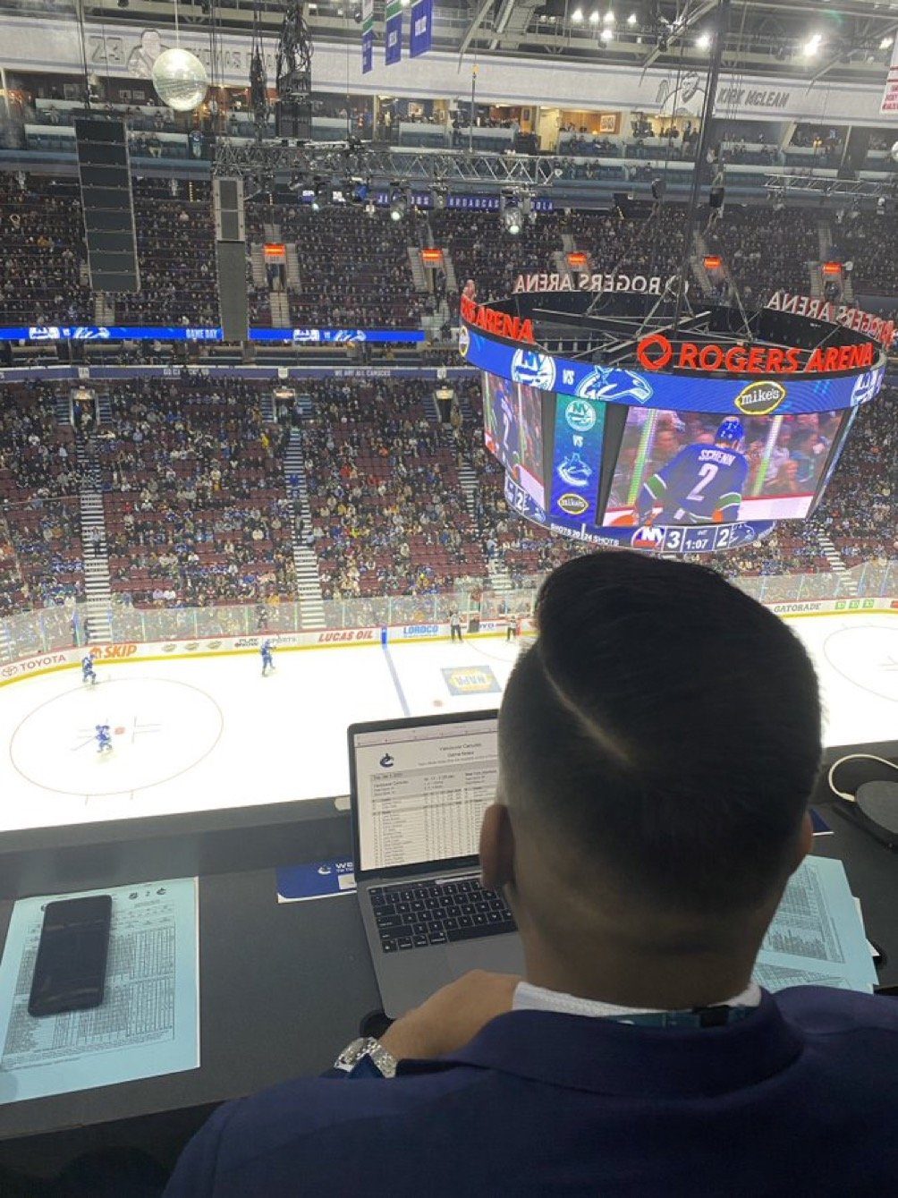 Lalli covering the action during a Canucks’ NHL game